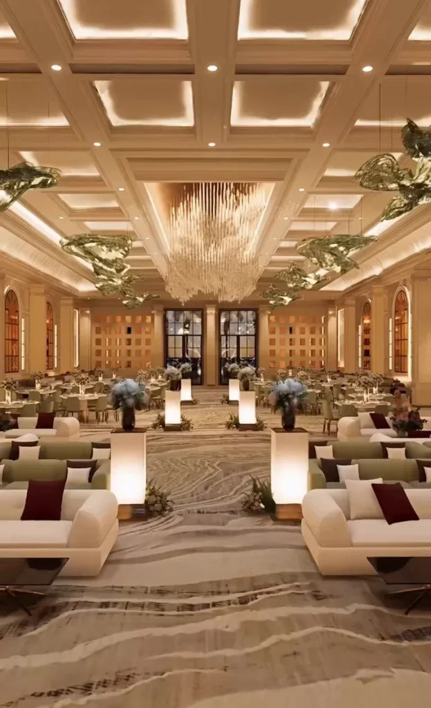 Coffered ceiling and crystal chandelier with glowing lanterns below